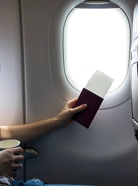 A woman seated on an airplane